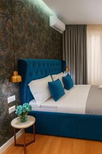 Postel nebo postele na pokoji v ubytování Hotel Capital Inn Tirana