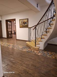 a staircase in a room with wooden floors at Resplendor Hotel in Viña del Mar