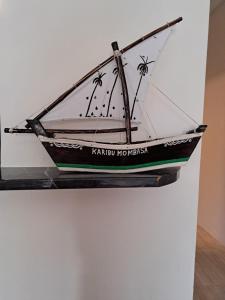 a model of a boat hanging on a wall at 1255 Vipingo Ridge 3BR Oasis in Kilifi