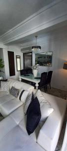 a living room with a couch and a pool table at Sea front luxury living apartment in sousse in Sousse +11 photos