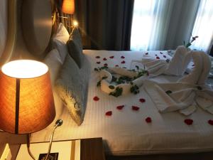 A bed or beds in a room at The Central Hotel