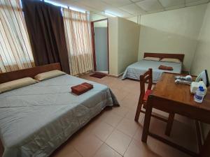 Postel nebo postele na pokoji v ubytování HotelChanglun
