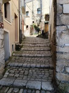 an alley in an old town with buildings at Avalon in Pietrelcina