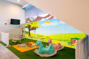 TV i/ili multimedijalni sistem u objektu BATIQA Hotel & Apartments Karawang