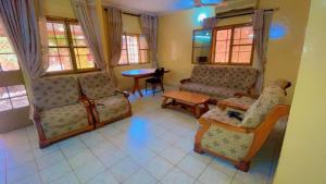 a living room with two couches and a table at AG appart'hôtel villas in Ouagadougou