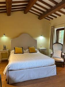 Ένα ή περισσότερα κρεβάτια σε δωμάτιο στο Saturnia Country Villas