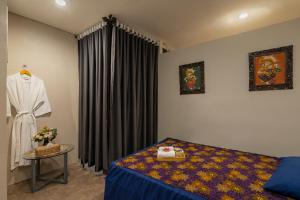 Krevet ili kreveti u jedinici u okviru objekta BATIQA Hotel & Apartments Karawang