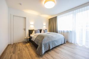 Postel nebo postele na pokoji v ubytování Appartements by Hofer