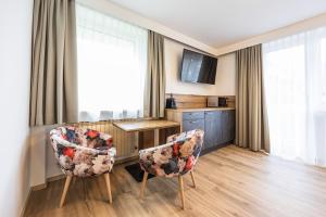 Sjónvarps- og/eða afþreyingartæki á Appartements by Hofer