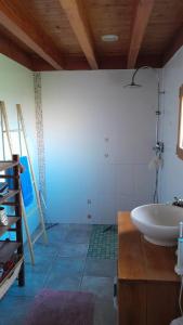 a bathroom with a white sink in a room at Maison conviviale à Lantic avec jardin de 100 m²_222 in Lantic