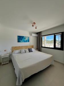 En eller flere senge i et værelse på Complejo Bahía del Sol