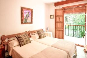 En eller flere senge i et værelse på Casa Corredera - Hello Vejer