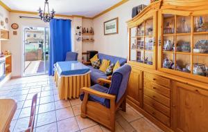a living room with a couch and a table at 5 Bedroom Cozy Home In El Portil in El Portil