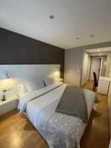 Postel nebo postele na pokoji v ubytování Hotel El Acebo
