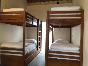 Postel nebo postele na pokoji v ubytování Roots Hotel Trawangan