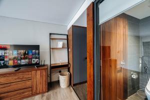 a bathroom with a shower and a sink at PentStudio Duplex Apartment in Hanoi +189 photos