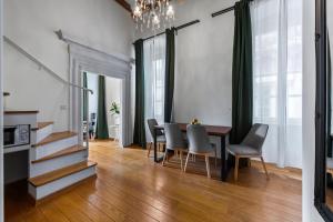 a dining room with a table and chairs at Palmotta Palace in Dubrovnik