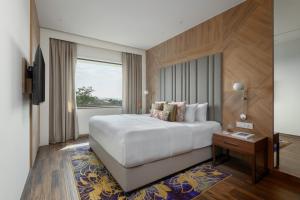 Postelja oz. postelje v sobi nastanitve Vivanta Mangalore Oldport Road - Formerly Known as Taj Manjarun
