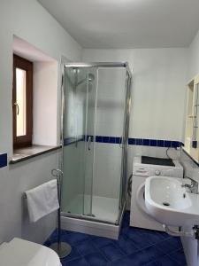 a bathroom with a shower and a sink at Casa Franchino in Pollica