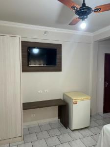 TV a/nebo společenská místnost v ubytování Hotel Parati Arapongas