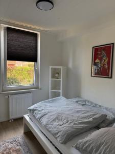 A bed or beds in a room at Renovated in style - Close to Hamburg