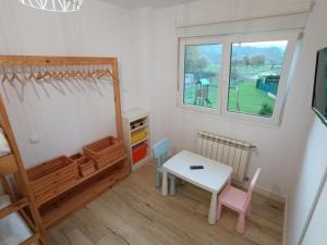 TV a/nebo společenská místnost v ubytování Apartamento reformado cerca de Cabarceno