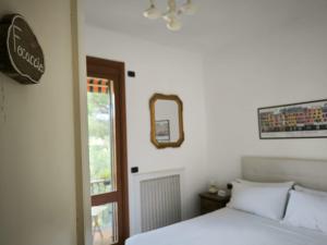 Postel nebo postele na pokoji v ubytování B&B Monte di Portofino