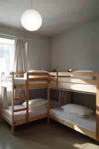 Postel nebo postele na pokoji v ubytování Ji Zi Inn