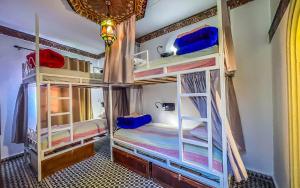 Una cama o camas en una habitación de Tangiers Hostel