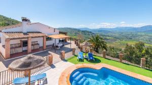 a villa with a swimming pool and a view at Casa Berrocal Álora by Ruralidays in Alora