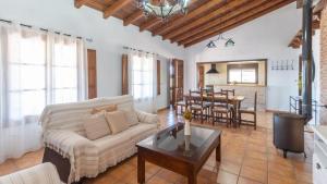 a living room with a couch and a table at Casa Berrocal Álora by Ruralidays in Alora