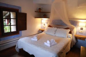 Posteľ alebo postele v izbe v ubytovaní Casa del Pastor-Brugarolas Village