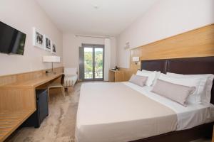 Basiliani - CDSHotels客房内的一张或多张床位