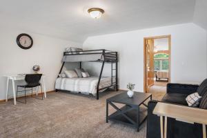 a living room with a bunk bed and a couch at Love Lake Manor in Nisswa