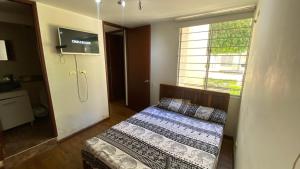 Postel nebo postele na pokoji v ubytování Apto en conjunto cerrado con piscina.