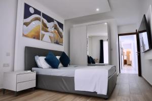Postel nebo postele na pokoji v ubytování Spinola Apartment