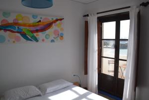 A bed or beds in a room at Allmar Hostel