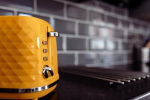 a yellow toaster sitting on top of a counter at Prestige Homes, Harwich in Parkeston