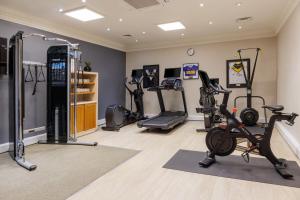 a gym with several exercise bikes and treadmills at Hilton York in York