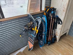 a pair of skis are leaning against a wall at River End A-Frame in Emily