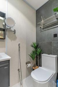 a bathroom with a white toilet and a sink at استديو فاخر سرير كينج ومطبخ Luxury Studio King Bed in Riyadh