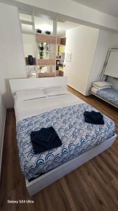 two black bags sitting on a bed in a room at Bethel House in Gardone Riviera
