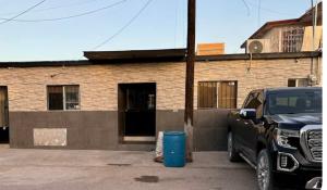 a truck parked in front of a brick building at Estancias Nava #2 in San Antonio