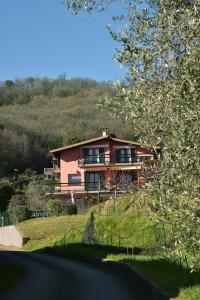 a house on the side of a hill at Lake Breeze Salò in Salò