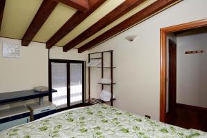 a bedroom with a bed and a window at Lake Breeze Salò in Salò