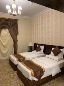 Voodi või voodid majutusasutuse ركن الرمال للشقق المخدومة toas