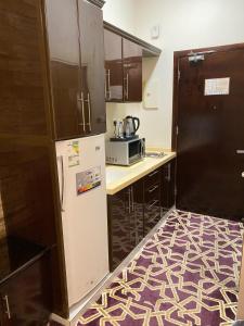 Köök või kööginurk majutusasutuses ركن الرمال للشقق المخدومة