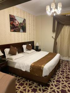 Voodi või voodid majutusasutuse ركن الرمال للشقق المخدومة toas