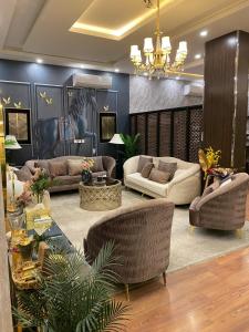 Posezení v ubytování ركن الرمال للشقق المخدومة + 4 fotografie