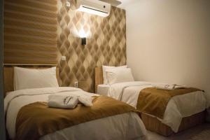 Postel nebo postele na pokoji v ubytování Hotel Alisa